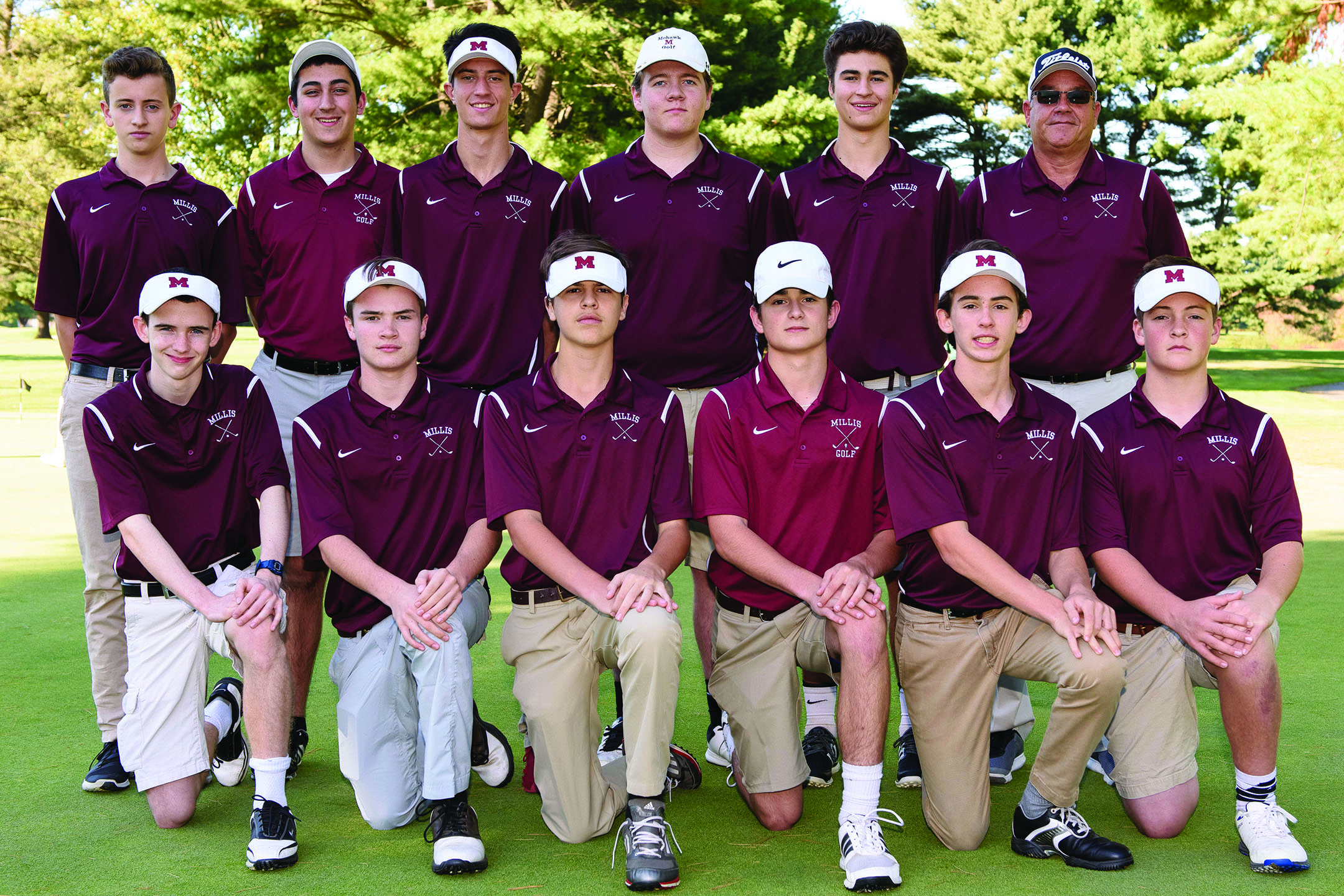 Millis High Golf, which usually sees low numbers, drew a large number this year. Coach Hodgdon is working on teaching the largely young players good habits on  the green.