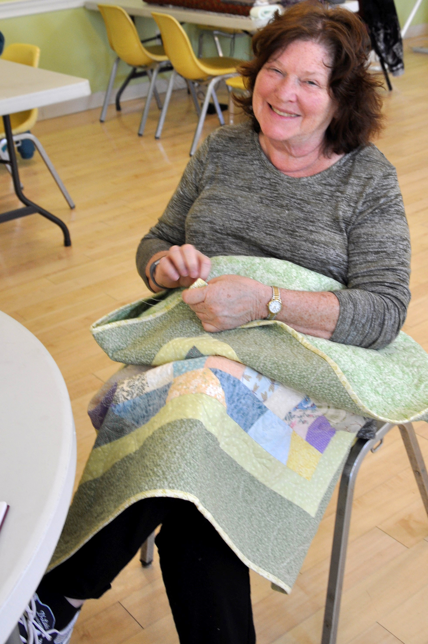 Longtime volunteer Cathie Healy believes The Power of the Quilt Project is a “win-win” for all those involved. (Photo/Deborah Burke Henderson)