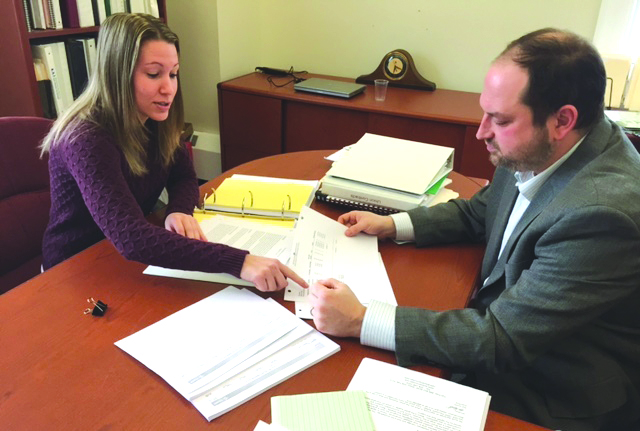 Finance Director Brittany Iacaponi and Town Manager Michael Herbert work on Ashland’s budget. (Photo/Deborah Burke Henderson)