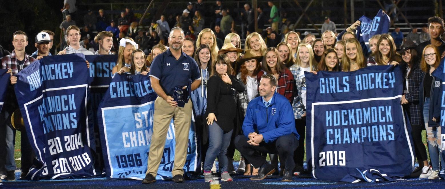 Franklin High Athletic Director Tom Angelo, Principal Paul Peri and some of the school’s athletes celebrate winning the Dalton Award, awarded by The Boston Globe to a high school that produces the top winning percentage in all varsity sports. Jen Papa photo