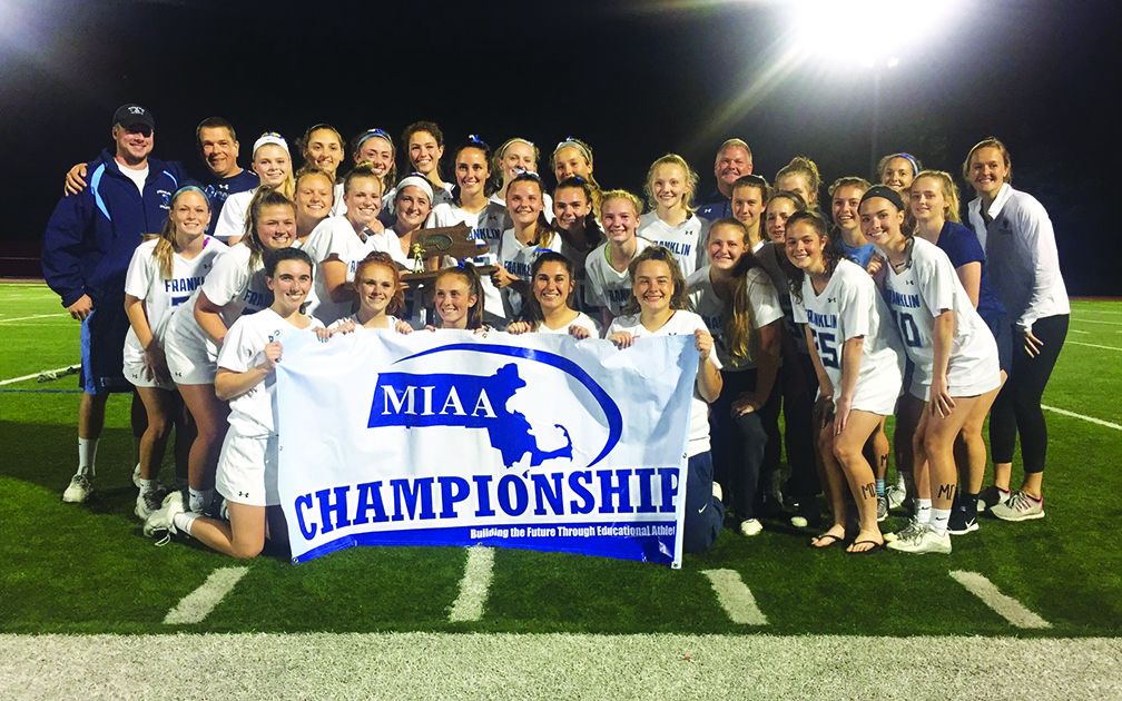 The Franklin High girls lacrosse team celebrates its Sectional championship after beating Concord-Carlisle in Milford.