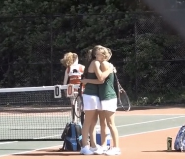 The two teammates hug before each meet, a tradition they established.