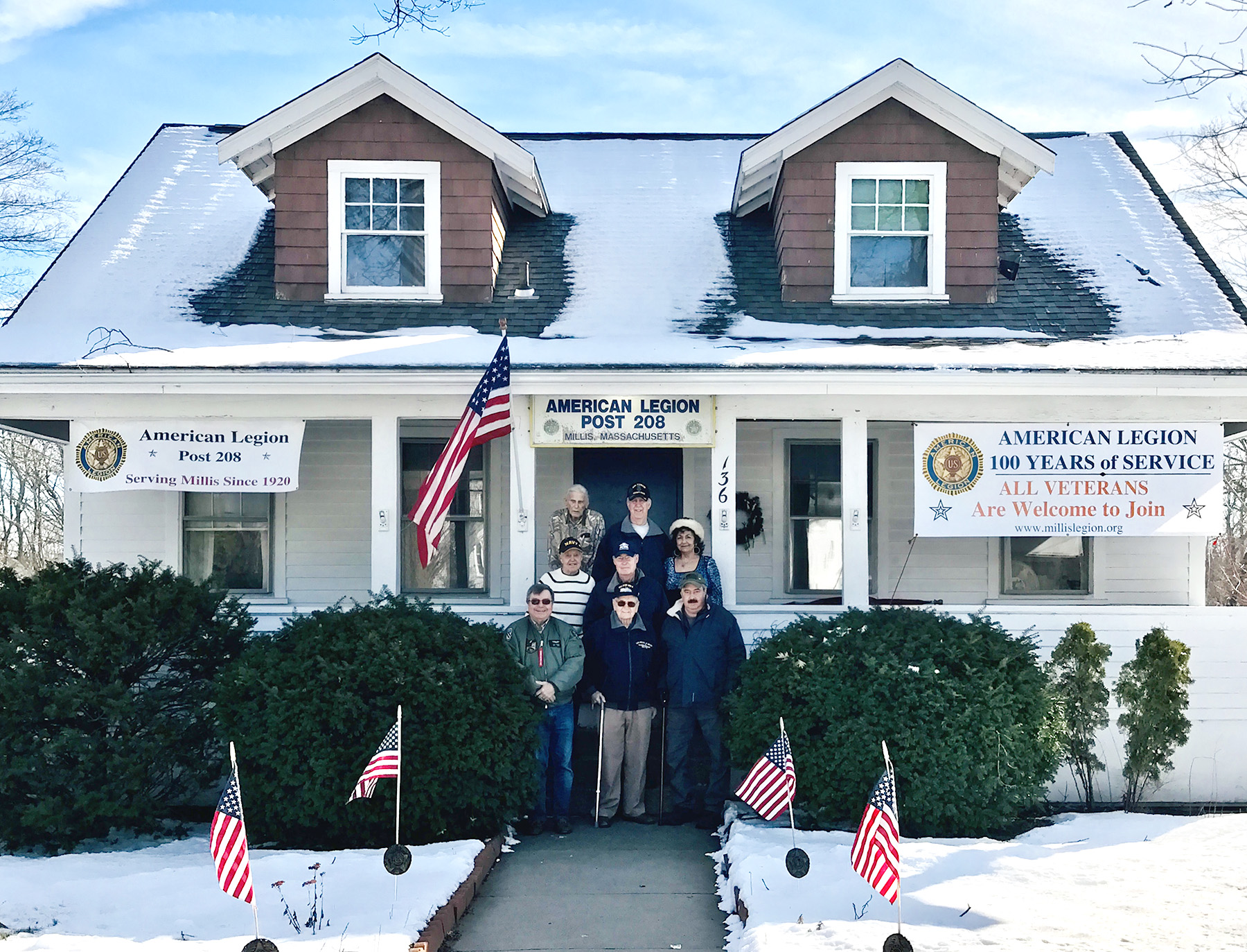 Millis American Legion Post 208 is celebrating its centennial year. Congress now allows ALL veterans to become Legionnaires, whether they served during wartime or peacetime.  Shown, L-R, top row, Bud Waite, Larry McCarter; middle row,  Harold Crosby, Tom Howie, Mary Ann Sheridan; bottom row,  Bob Yeager, Wayne Hanson, and Mark Slayton.