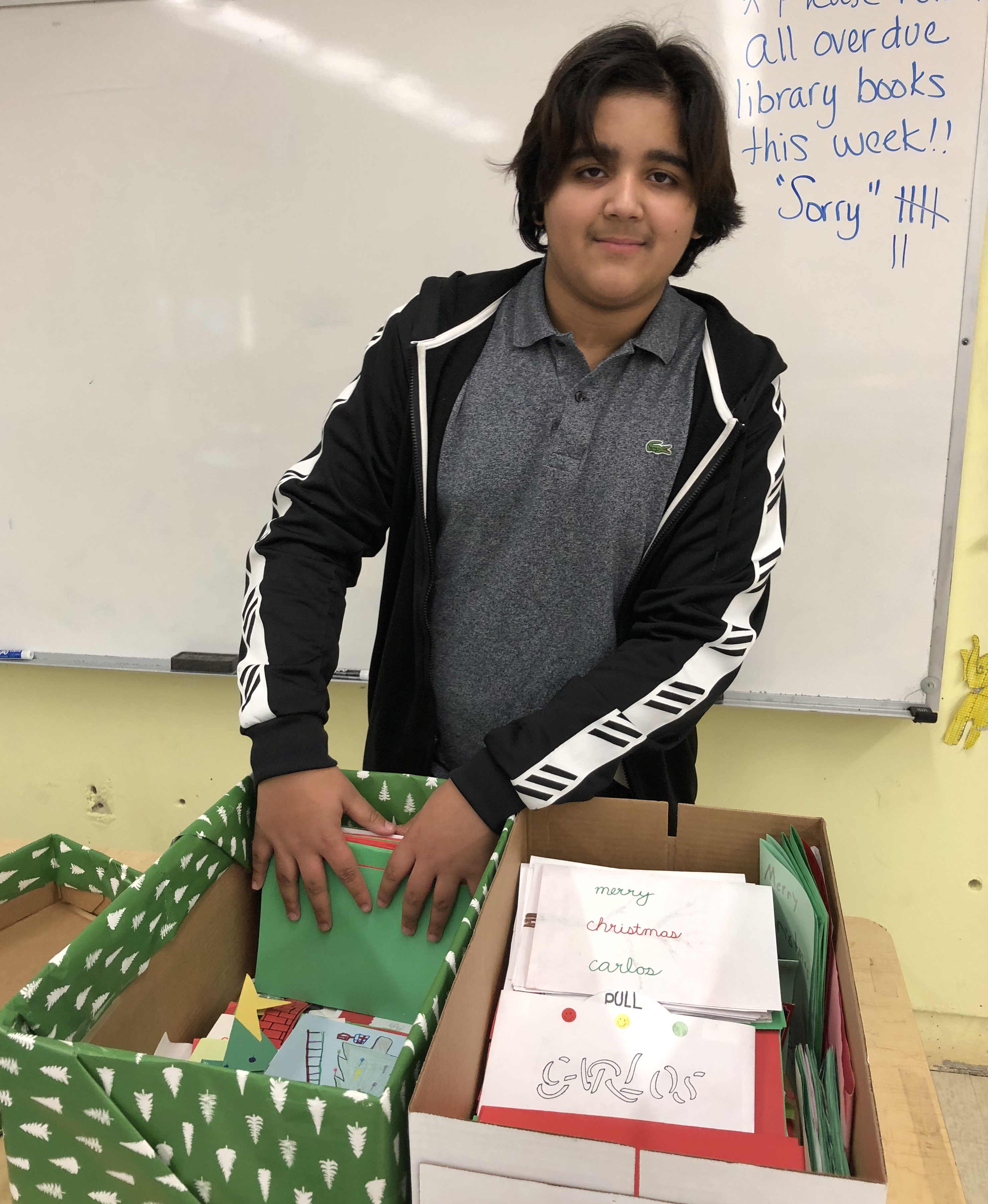 Medway Middle Schooler Taylor Benner, 13, is shown here with a box of good wishes for Boston Children’s Hospital heart patient Carlos Rolon, whose Mom had made his wish for Christmas cards public. Taylor brought the idea to his teacher, and his fellow students enthusiastically responded.