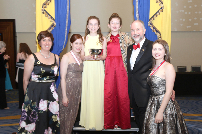 Reese, Taryn and Morgan Holmes, of Holliston, are members of the Children of American Revolution Jack Russell Society, which recently won a National Merit Award, among 564 active societies. From left, Jackie Holmes, Sarah Borgatti (Senior Society President), Reese Holmes (Society President), Taryn Holmes, James Holmes, Morgan Holmes - members and seniors of the Jason Russell Society