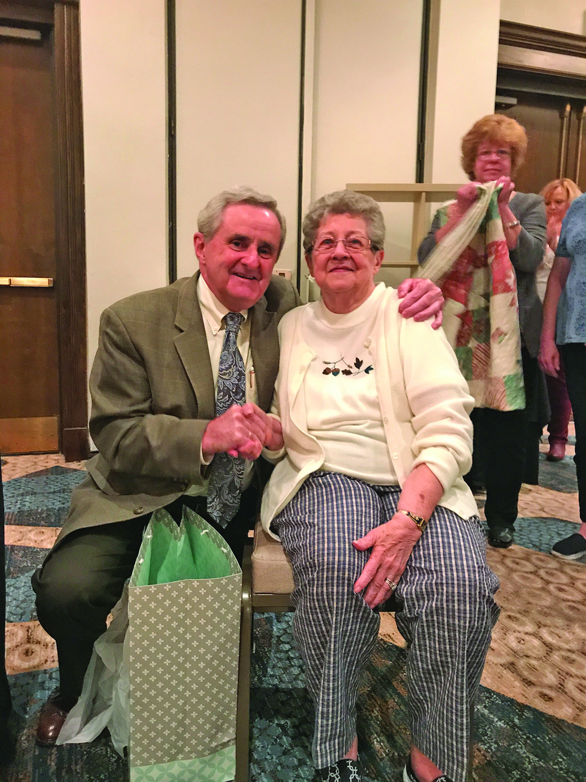 Betty Butcher receives a citation from Governor Baker for her service to the Alumni Association.