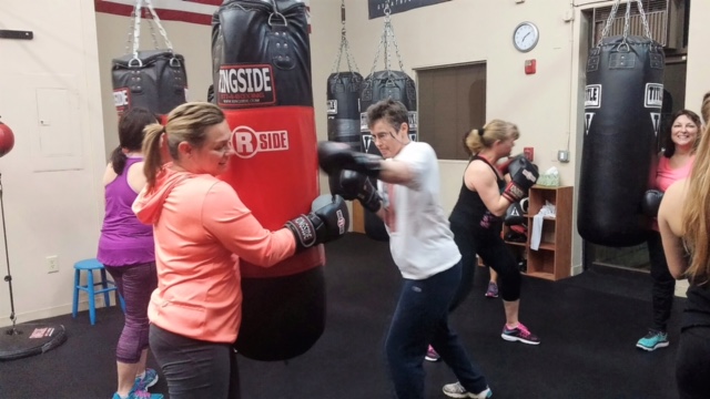 Mary Smith (right) jabs with Robin Christie (left)