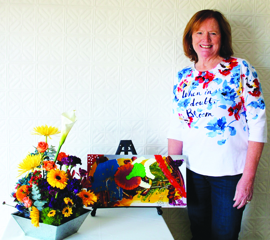 Nancy Costa, President of Norwood Evening Garden Club and Art in Bloom chair interpreted Walpole artist Jenna McDonald’s acrylic on metal painting.