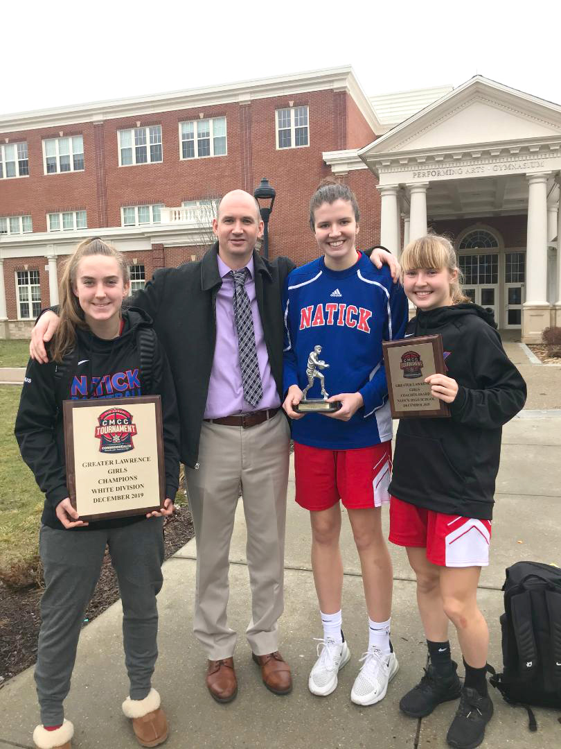 Coach Dan Hinnenkamp with his captains (from left) Emily Gustus, Brenna McDonald and Laney Ross.)