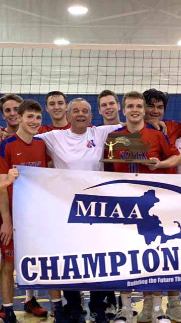 Natick coach Peter Suxho and his volleyball team celebrate their Sectional championship.