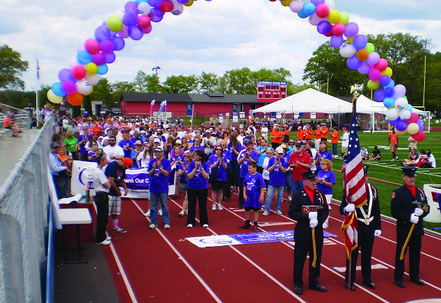 Cancer Survivors and their caregivers wait to take the opening lap at Relay For Life of Natick, Framingham and Sherborn. (Photo/supplied)