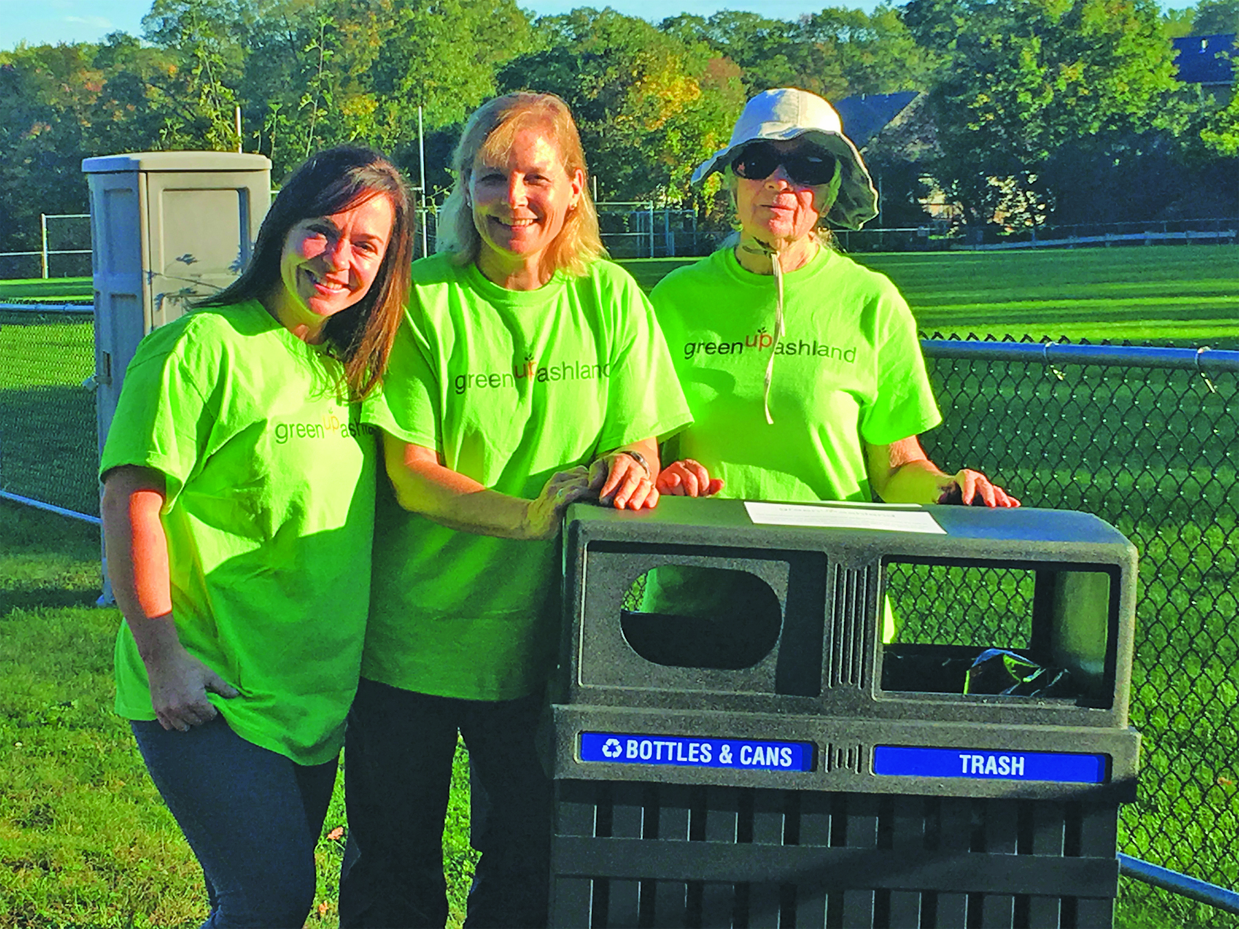 GreenUp members Karyn Dann, Janet Gamache and Jeanne Walker stand by the newly installed public recycling/trash bin behind the Ashland Community Center. (Photo/supplied)