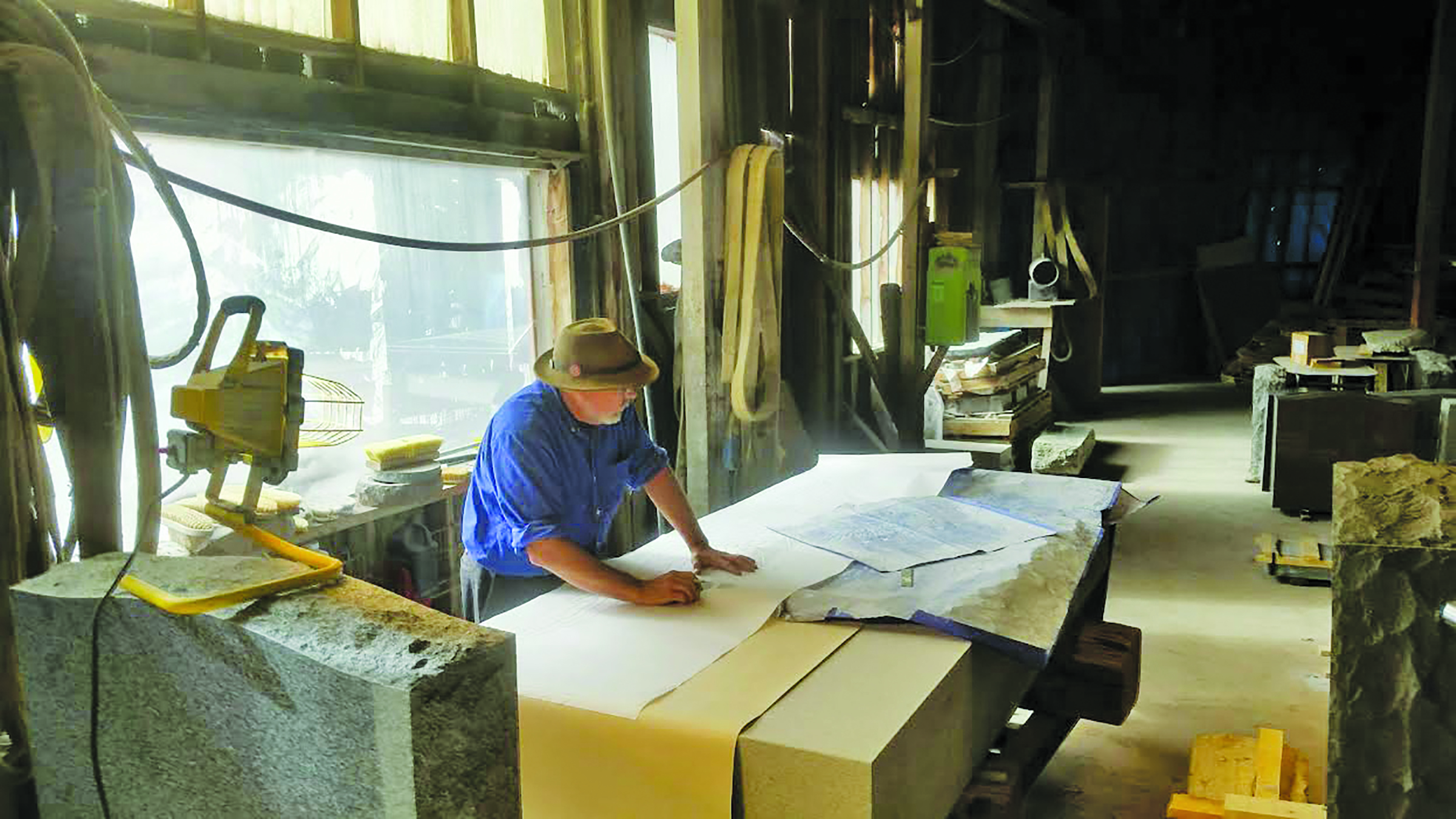 John Monti, of A. Monti Granite Company, in Quincy lays etchings atop granite that will become Millis’ memorial to its fallen veterans from the Vietnam War through all conflicts to the present day. The stone came from the same quarry as the Vietnam/Korean monument, which was etched by Monti’s father. It will be dedicated at the Millis Veterans Day ceremony at 11 a.m. on November 11.