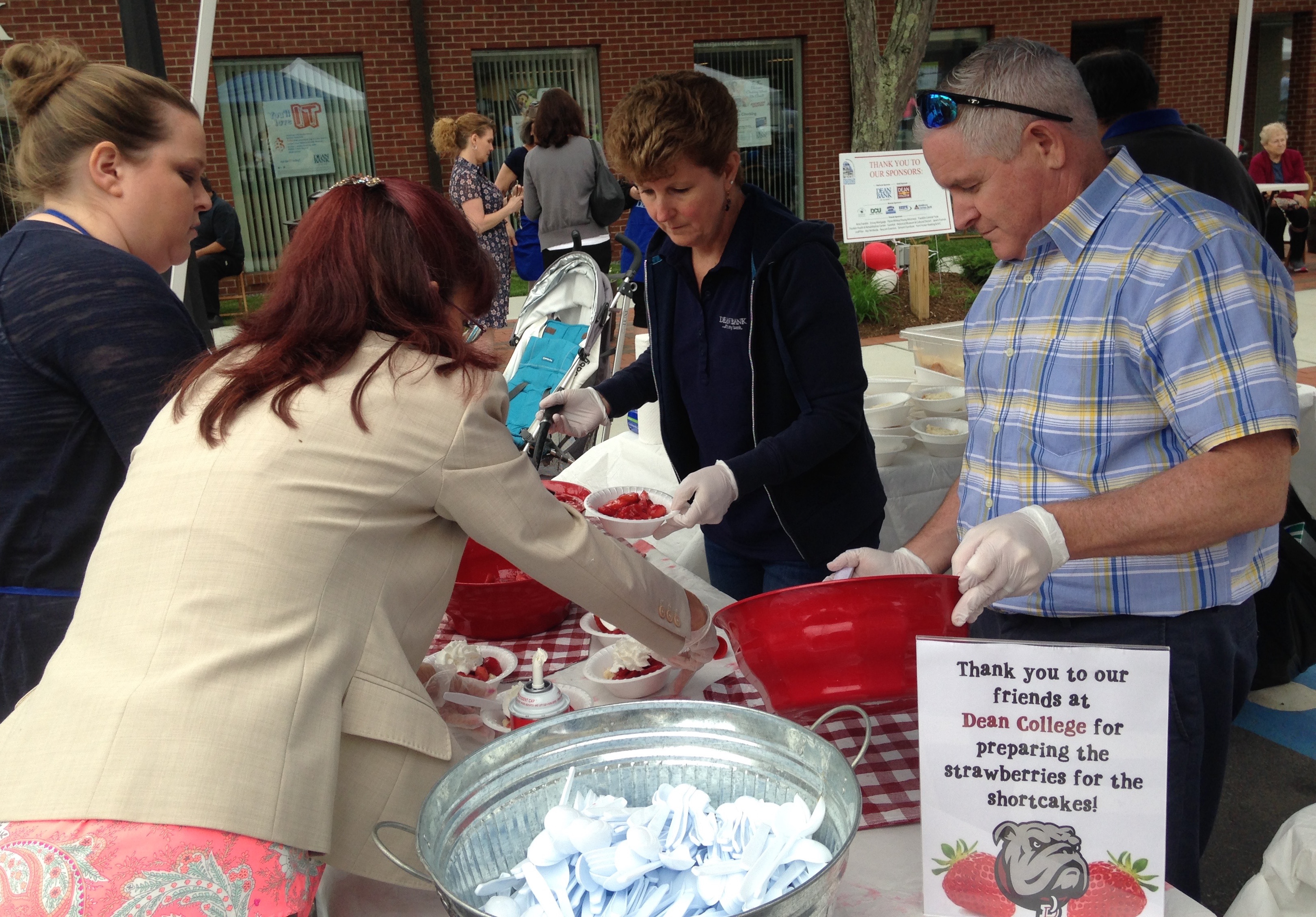 Shown are last year’s volunteers from Dean Bank working together to provide Franklin’s Strawberry Strollers with their signature treat. This year’s event will take place on a Friday night, June 8th, with added features like kindness rocks and a block party.